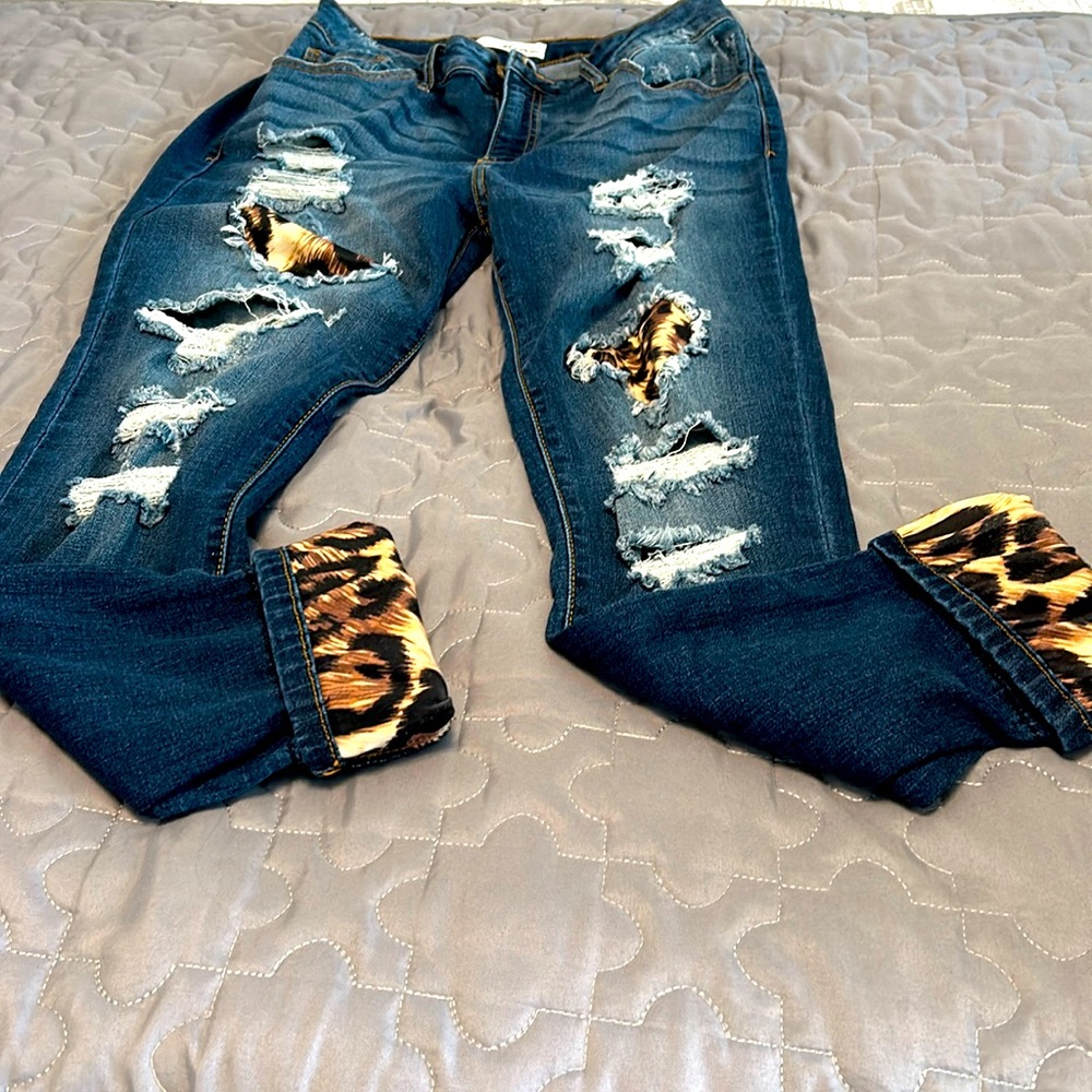 KanCan distressed leopard inset jeans.